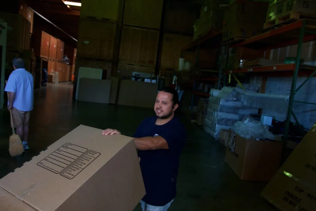 Picture of  In the dim glow of a well-organized storage space, a worker at Advantage Moving & Storage carefully lifts a labeled box, embodying the company’s focus on quality outcomes. Recognized for expertise and quality, Advantage excels in delivering secure and efficient storage solutions. Copyright ©2025 Diamond Certified Resource.

 - Advantage Moving & Storage