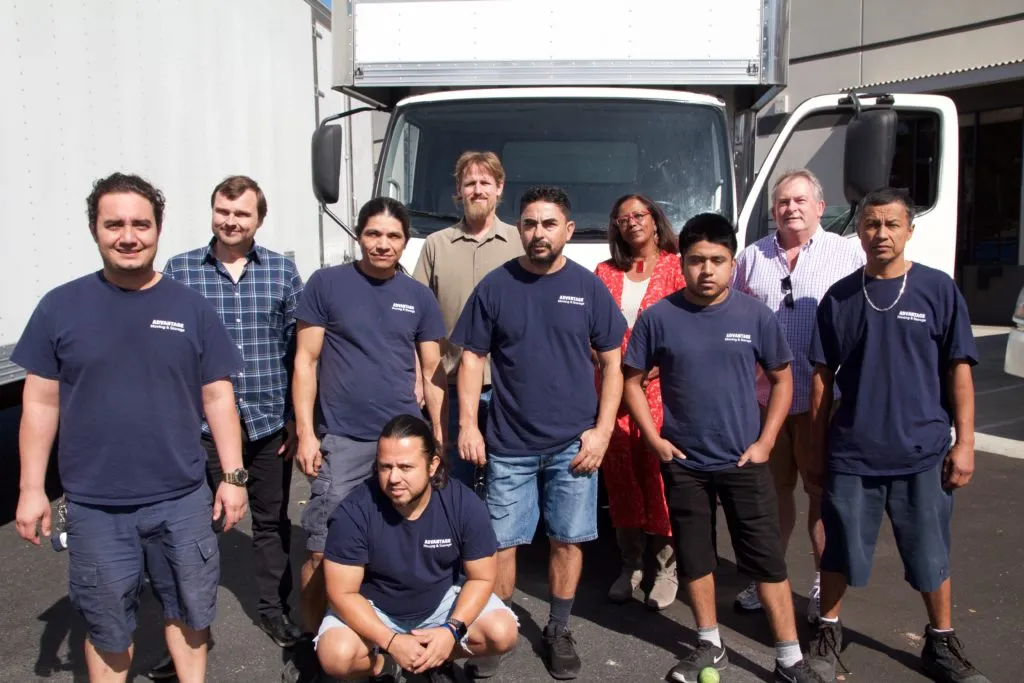 Picture of  A dedicated team from Advantage Moving & Storage stands united in front of a moving truck, embodying top-rated quality and expert service. With each member contributing to high customer satisfaction, they are recognized for excellence. Copyright ©2025 Diamond Certified Resource.

 - Advantage Moving & Storage