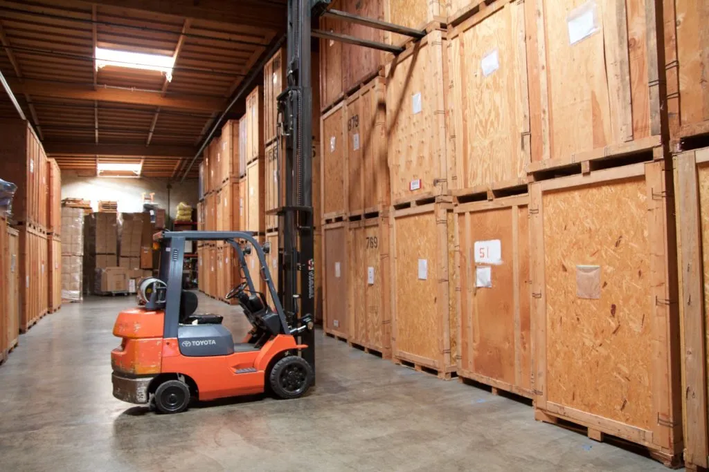 Picture of  In a well-organized storage facility, a forklift navigates tightly packed crates, each representing a story of transition and safekeeping. Advantage Moving & Storage ensures high customer satisfaction ratings by focusing on quality outcomes. Copyright ©2025 Diamond Certified Resource.

 - Advantage Moving & Storage