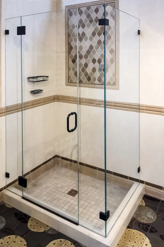 Picture of  A pristine glass shower enclosure, featuring elegant tile work, showcases Schicker Luxury Shower Doors, Inc.'s commitment to quality outcomes. Known for high customer satisfaction ratings, their craftsmanship transforms spaces into serene retreats. Copyright ©2025 Diamond Certified Resource.

 - Schicker Luxury Shower Doors, Inc.