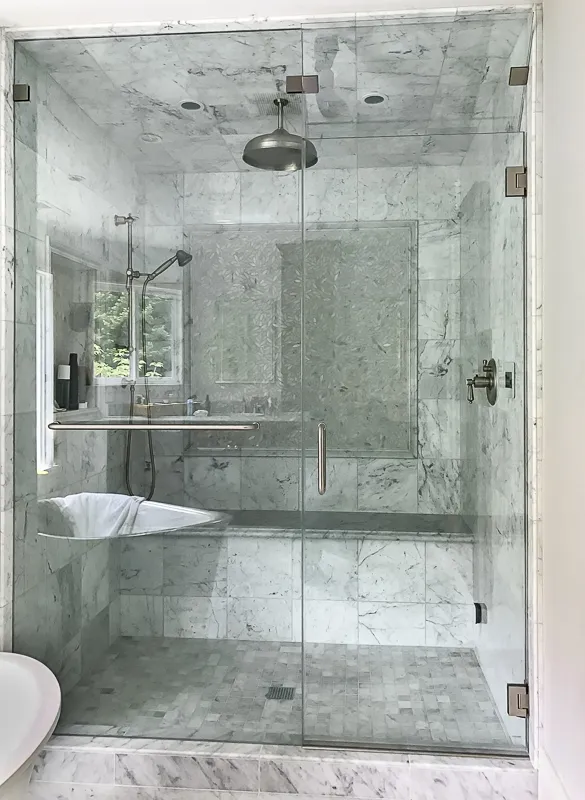 Picture of  A pristine marble shower showcases the luxury and craftsmanship of Schicker Luxury Shower Doors, Inc. Their focus on quality outcomes is evident in every detail. Copyright ©2025 Diamond Certified Resource.

 - Schicker Luxury Shower Doors, Inc.