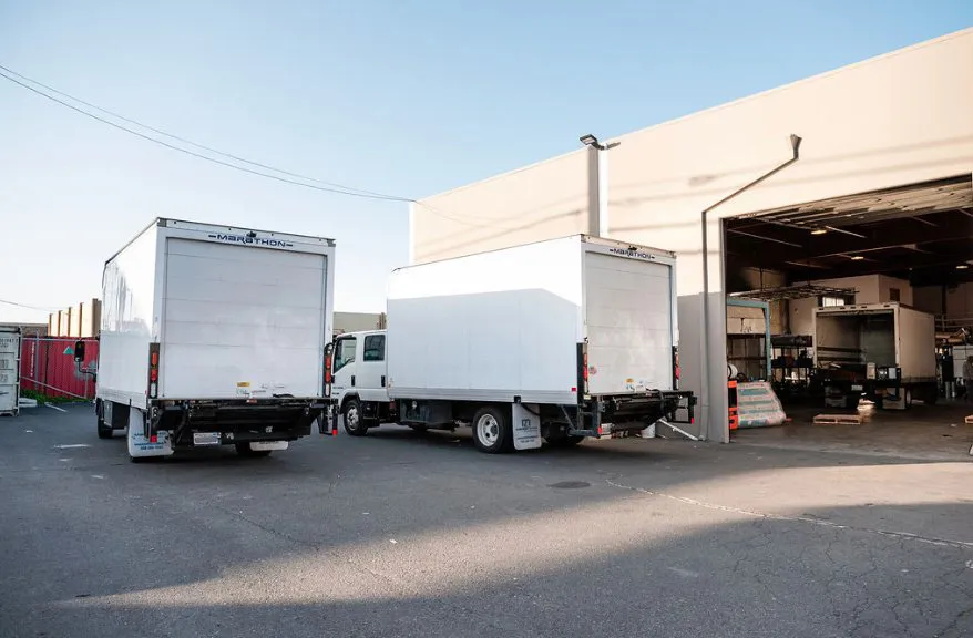 Picture of Alley Cat's fleet of pristine trucks stands ready outside their facility, embodying their commitment to quality outcomes. Their dedication to high customer satisfaction ratings drives their service excellence. Copyright ©2025 Diamond Certified Resource

 - Alley Cat