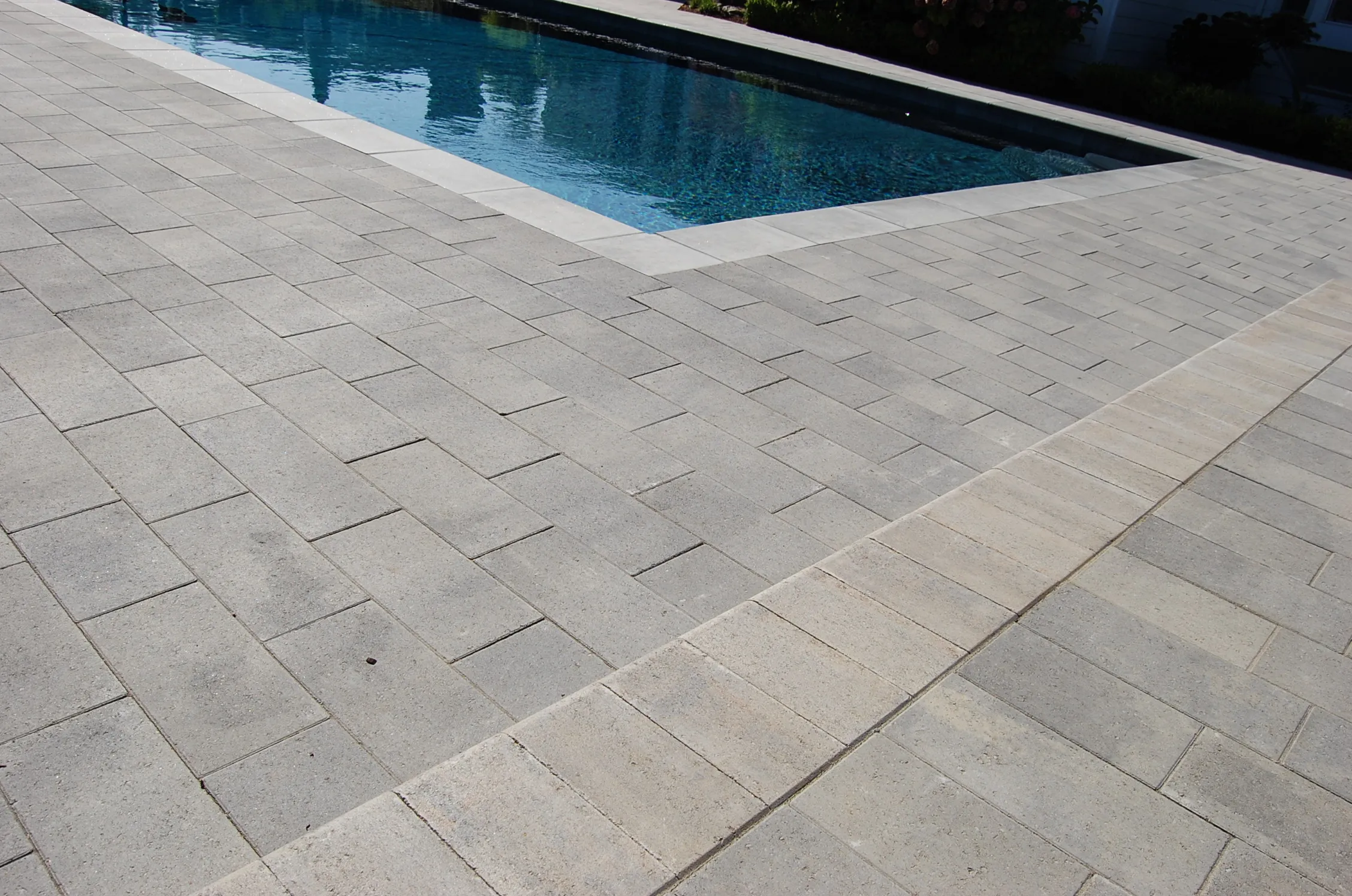 Picture of The Legacy Paver Group showcases precision with meticulously laid paving stones surrounding a serene pool, reflecting their focus on quality outcomes and high customer satisfaction ratings. Copyright ©2025 Diamond Certified Resource

 - The Legacy Paver Group