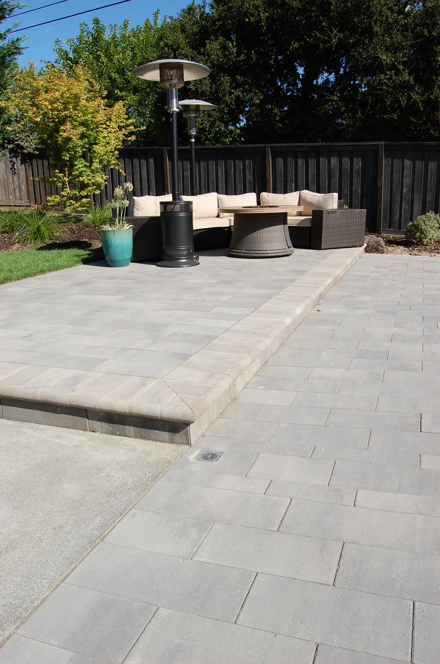 Picture of The Legacy Paver Group transforms a simple backyard into an inviting retreat with expertly laid pavers and cozy seating, reflecting their commitment to quality outcomes. Copyright ©2025 Diamond Certified Resource

 - The Legacy Paver Group