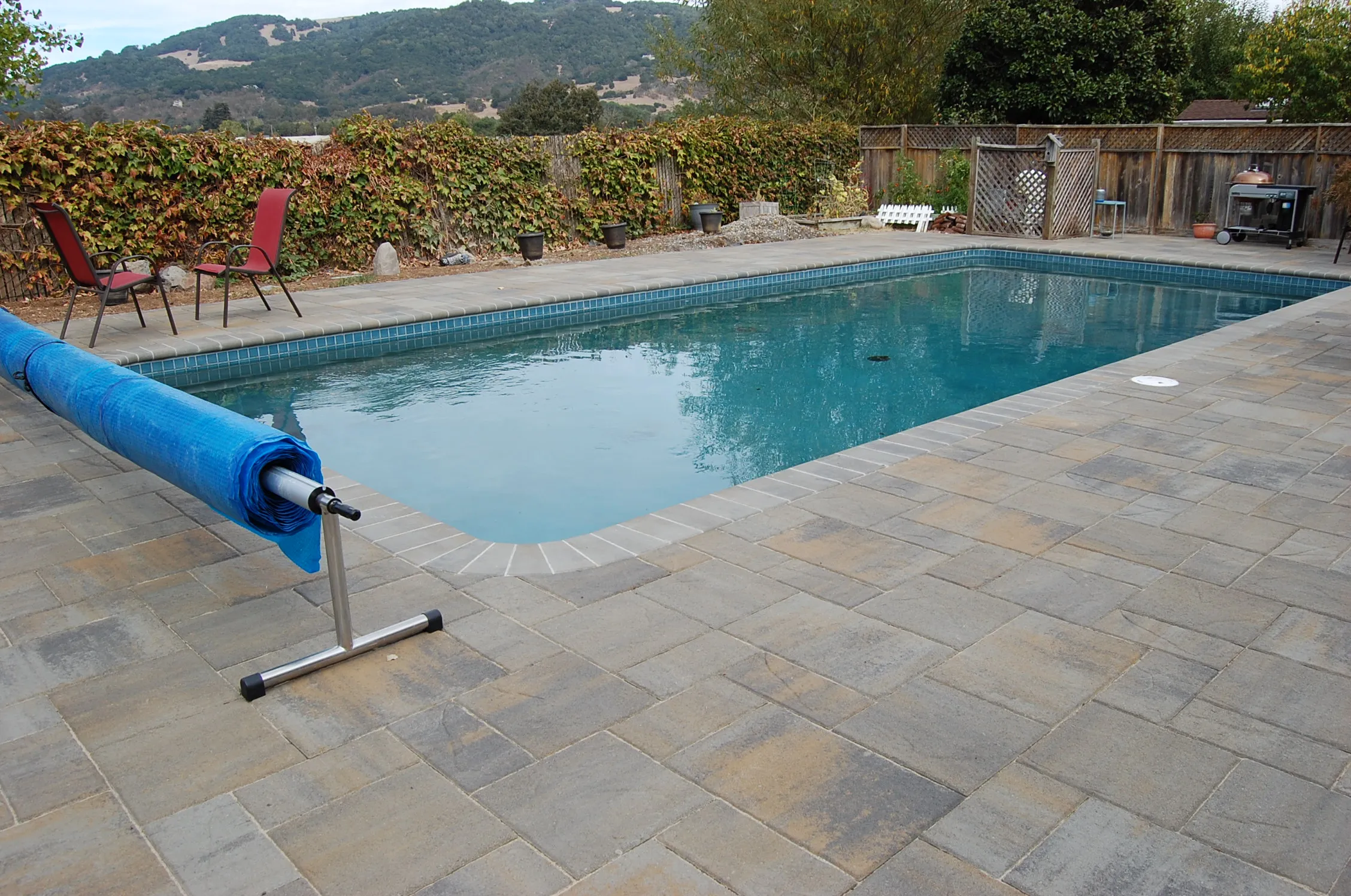 Picture of Amidst a serene landscape, The Legacy Paver Group showcases their craftsmanship with a pristine poolside patio, enhancing outdoor elegance. Recognized for high customer satisfaction, they bring quality to every project. Copyright ©2025 Diamond Certified Resource

 - The Legacy Paver Group