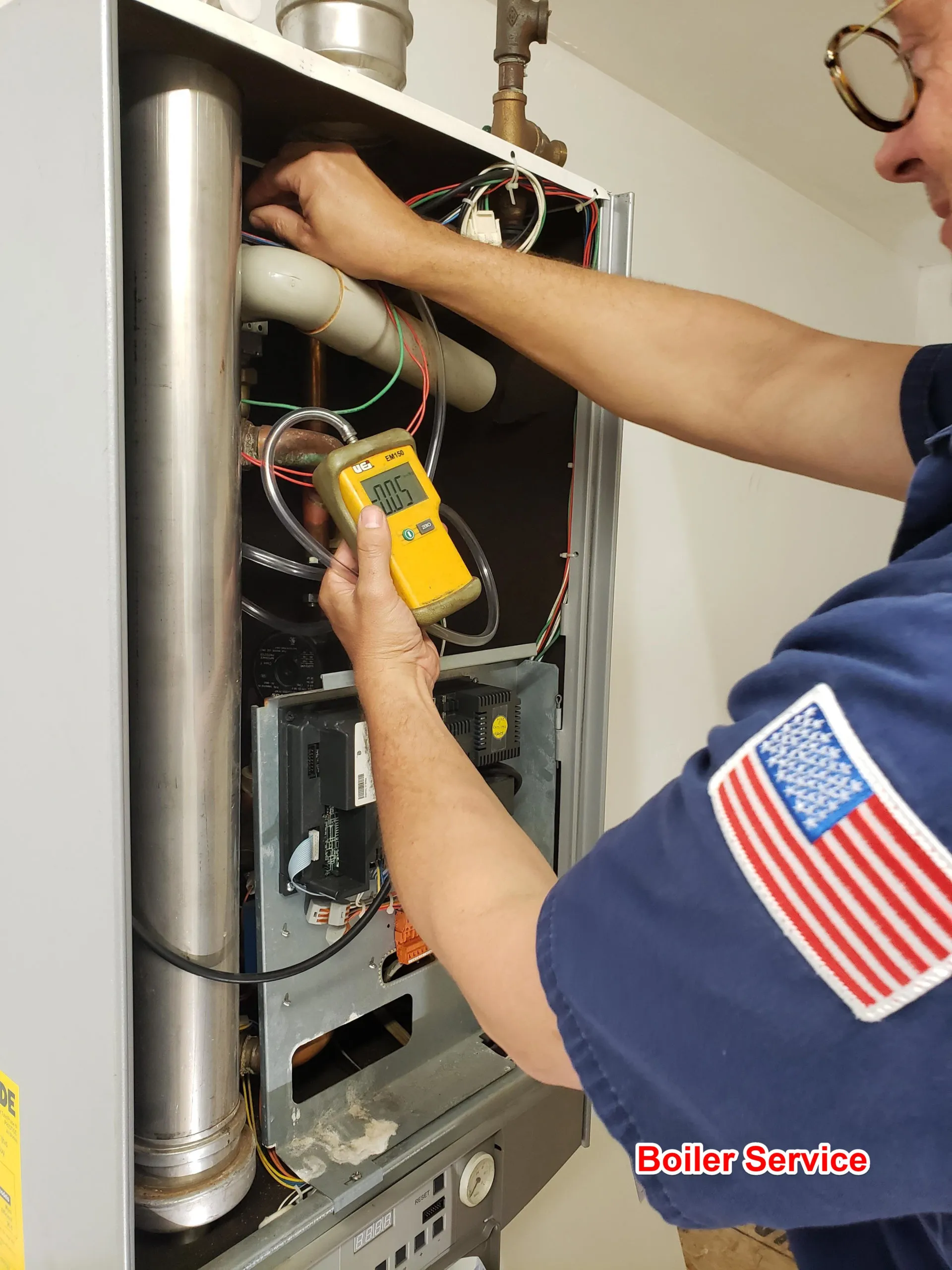 Picture of A skilled technician from Big Blue Plumbing carefully analyzes a boilerâ€™s inner workings, embodying the companyâ€™s focus on quality outcomes. Big Blue Plumbing is recognized for expertise and quality. Copyright ©2025 Diamond Certified Resource

 - Big Blue Plumbing