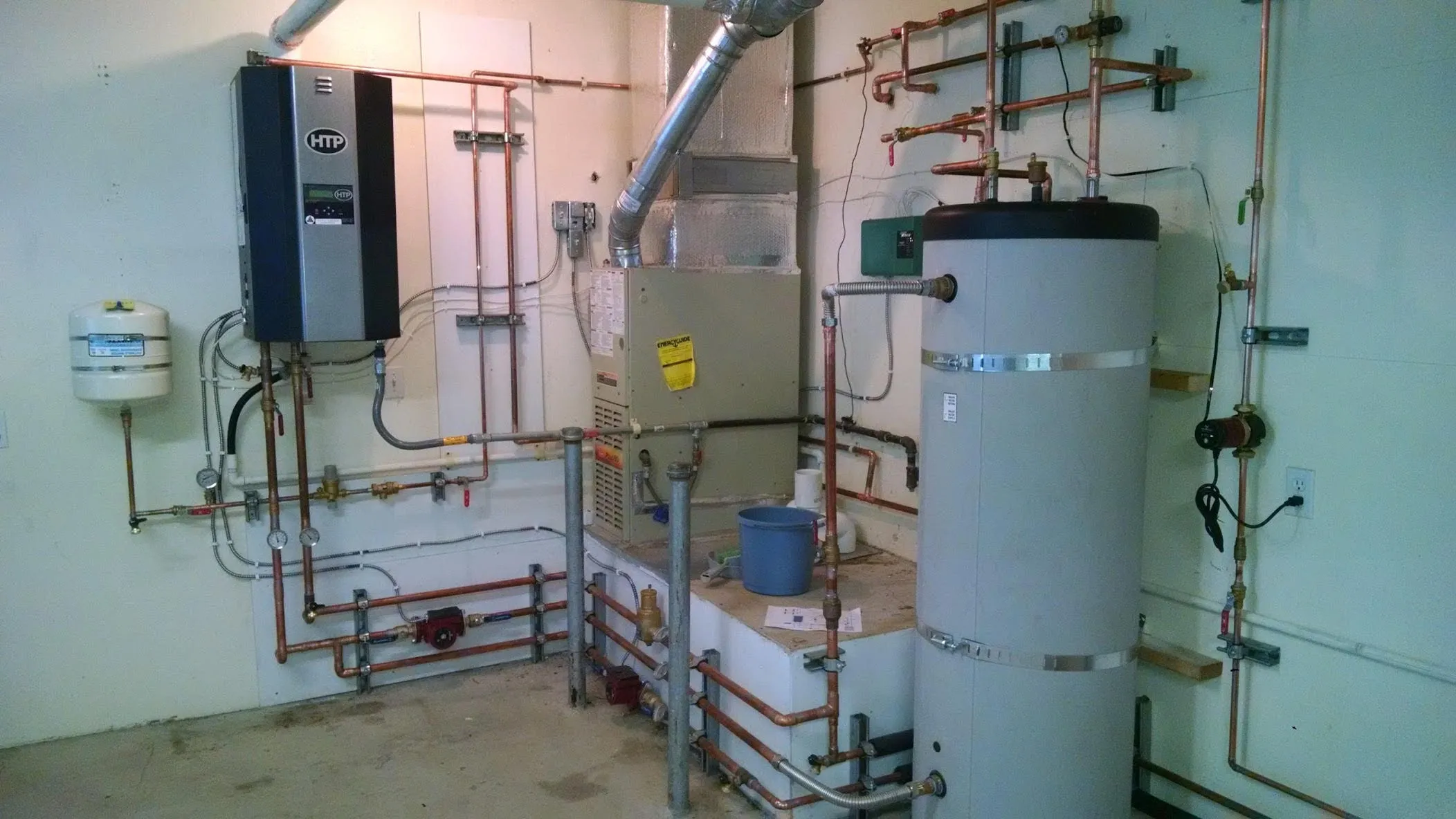 Picture of In the heart of a utility room, Big Blue Plumbing's efficient installation showcases a complex network of pipes and systems, highlighting their focus on quality outcomes. Copyright ©2025 Diamond Certified Resource

 - Big Blue Plumbing