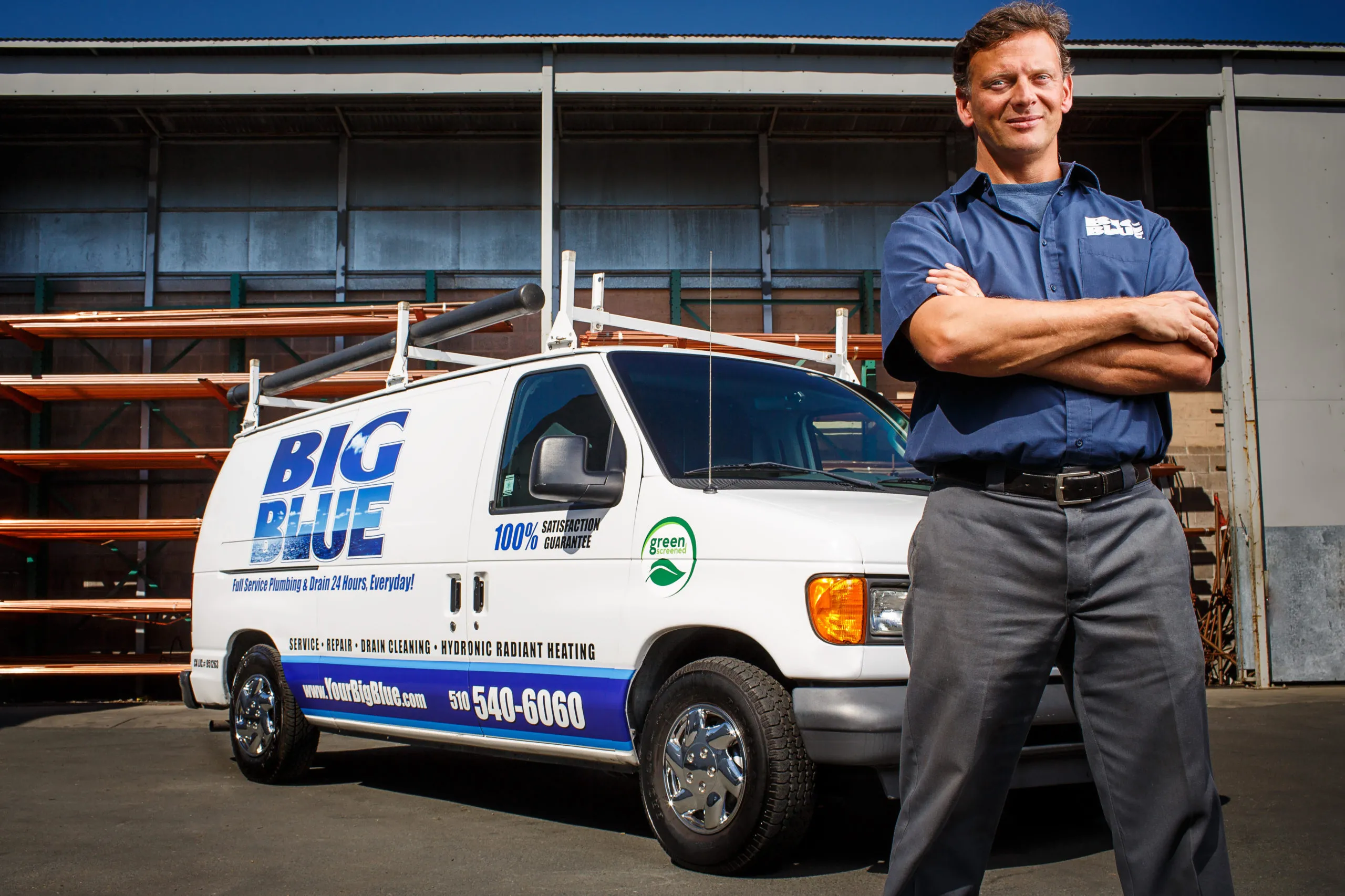 Picture of Standing confidently beside a Big Blue Plumbing van, an employee embodies the company's commitment to quality outcomes. Recognized for expertise and quality, Big Blue Plumbing ensures customer satisfaction. Copyright ©2025 Diamond Certified Resource

 - Big Blue Plumbing