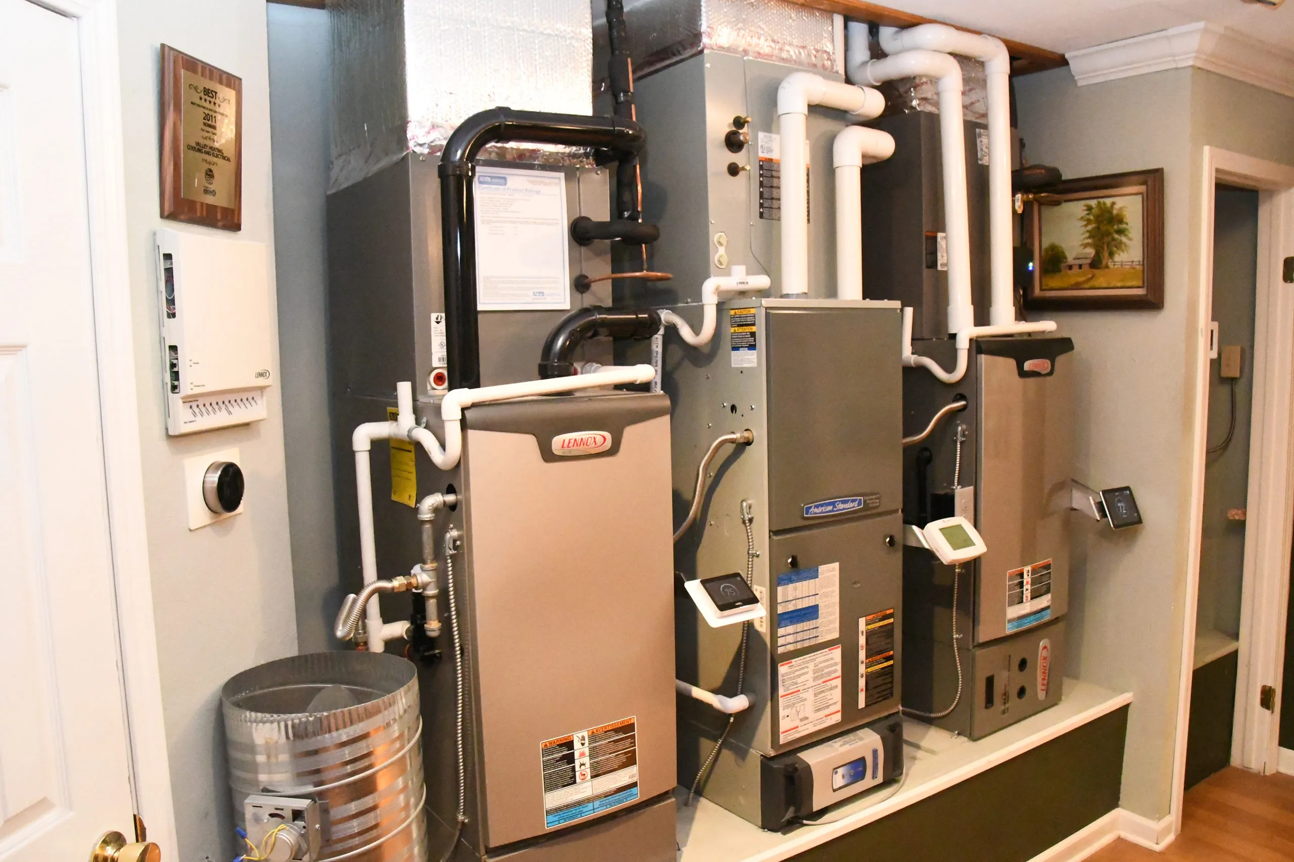 Picture of In a neatly arranged utility room, modern HVAC systems reflect Valley Heating, Cooling, Electrical and Solar's expertise. Each component signifies innovation and quality outcomes. Copyright ©2025 Diamond Certified Resource

 - Valley Heating, Cooling, Electrical and Solar