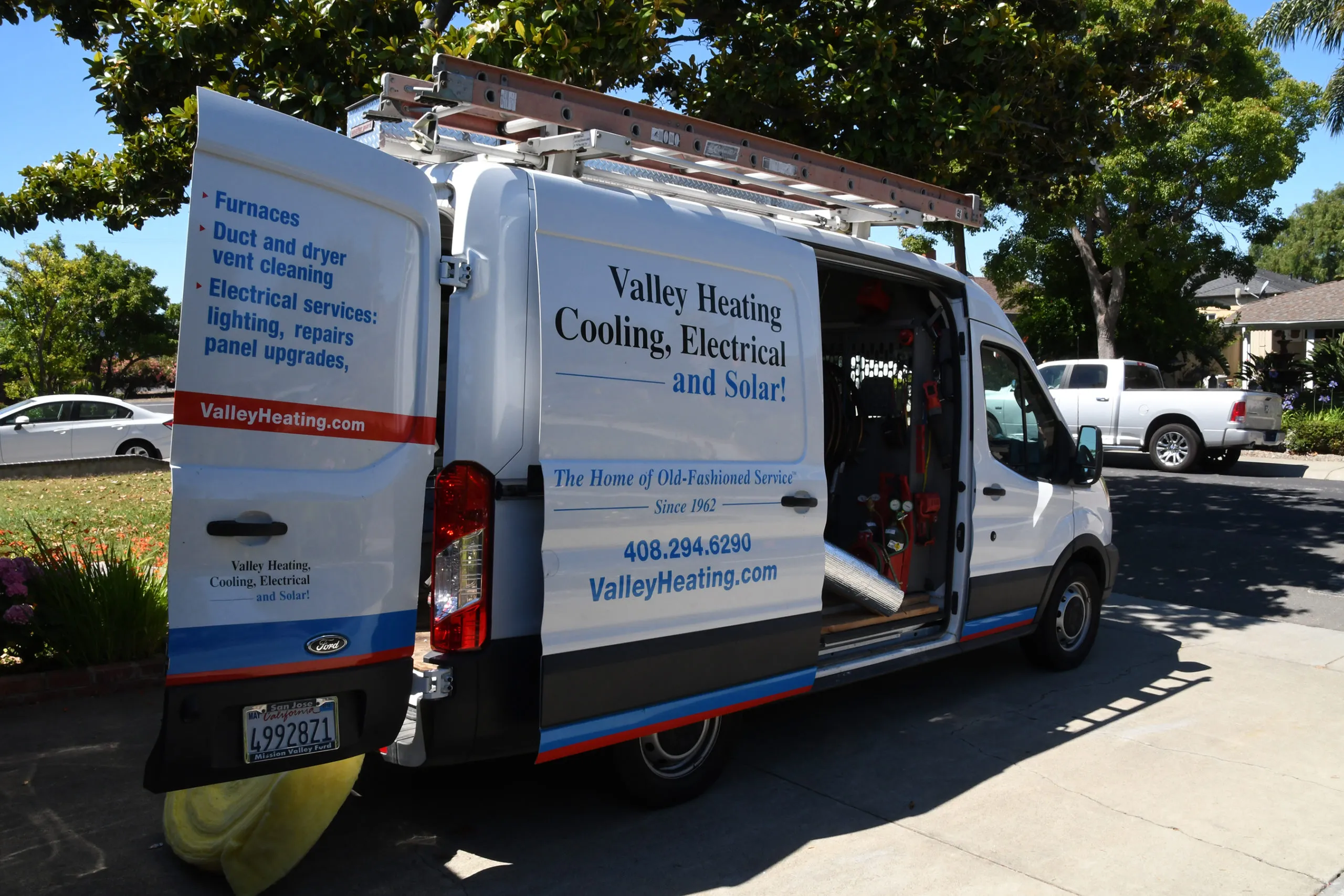 Picture of In the quiet shade of a suburban street, Valley Heating, Cooling, Electrical and Solar's service van stands ready, reflecting the companyâ€™s enduring dedication to quality outcomes since 1962. Copyright ©2025 Diamond Certified Resource - Valley Heating, Cooling, Electrical and Solar