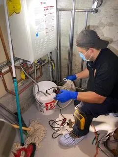 Picture of A technician from Discover Plumbing & Rooter skillfully maintains a water heater, ensuring optimal performance. This moment reflects the companyâ€™s dedication to quality outcomes in plumbing solutions. With high customer satisfaction ratings, Discover Plumbing & Rooter continues to excel. Copyright ©2025 Diamond Certified Resource

 - Discover Plumbing & Rooter