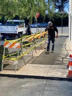 Picture of A Discover Plumbing & Rooter technician inspects a secured worksite on a sunny day, ensuring safety and quality. The company's focus on quality outcomes shines through in every project. Copyright ©2025 Diamond Certified Resource

 - Discover Plumbing & Rooter