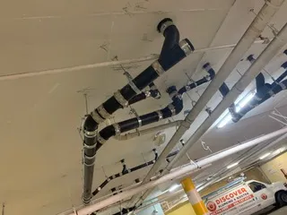 Picture of Discover Plumbing & Rooter showcases expertise with precision-installed piping in a commercial space ceiling, exemplifying a focus on quality outcomes. Copyright ©2025 Diamond Certified Resource - Discover Plumbing & Rooter