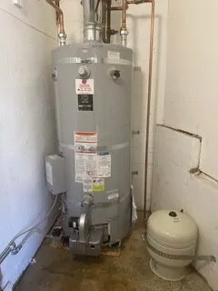 Picture of In a quiet corner, a water heater stands as a testament to Discover Plumbing & Rooter's focus on quality outcomes. Its steady presence hints at the unseen expertise ensuring reliable function. Copyright ©2025 Diamond Certified Resource

 - Discover Plumbing & Rooter