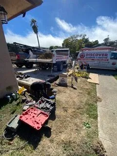 Picture of Amidst the bustle of a residential service, Discover Plumbing & Rooterâ€™s van stands ready, emphasizing the companyâ€™s focus on quality outcomes. Copyright ©2025 Diamond Certified Resource - Discover Plumbing & Rooter