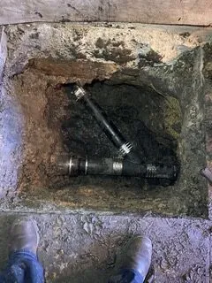 Picture of A glimpse into the foundation reveals newly installed pipes by Discover Plumbing & Rooter, exemplifying their commitment to quality outcomes. Here, the focus is on precision and durability. Copyright ©2025 Diamond Certified Resource - Discover Plumbing & Rooter