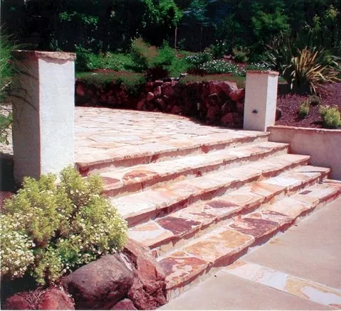 Picture of  Amidst lush greenery, a series of meticulously crafted stone steps ascend gracefully. This elegant outdoor feature exemplifies Paradigm Concrete & Construction, Inc.'s focus on quality outcomes, highlighting their commitment to excellence. Copyright ©2025 Diamond Certified Resource.

 - Paradigm Concrete & Construction, Inc.