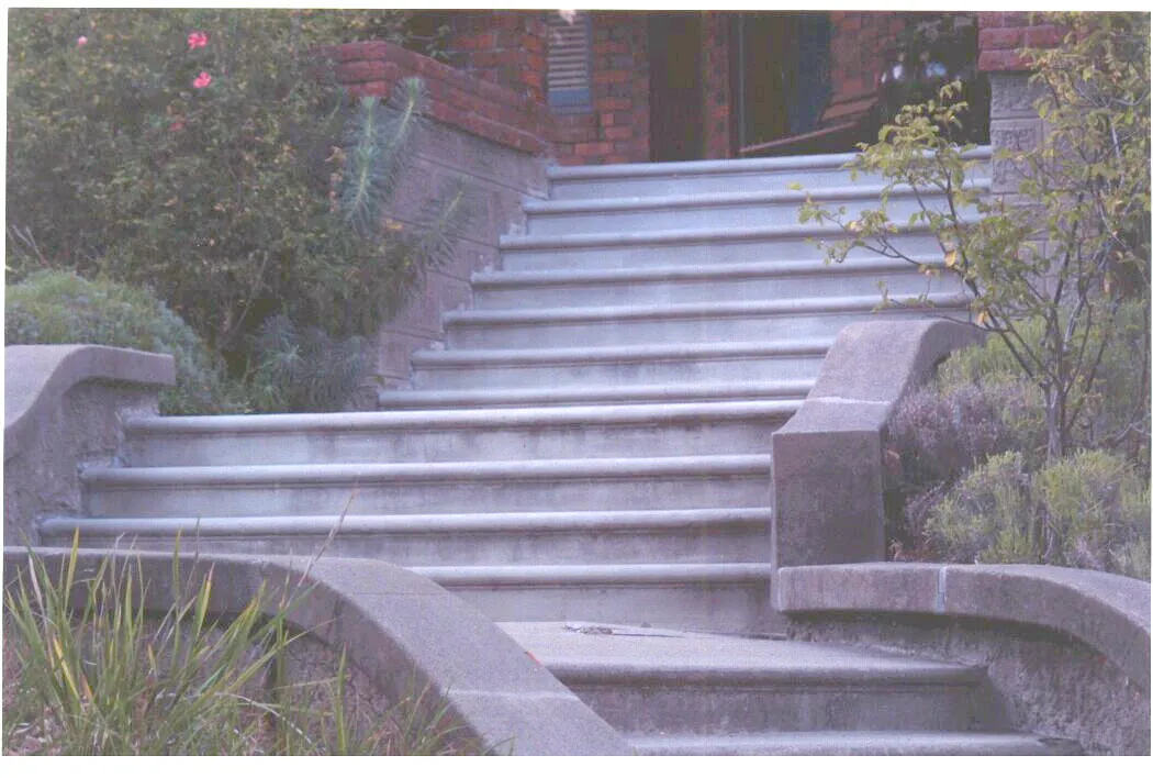 Picture of  The precisely crafted concrete steps lead to a stately entrance, showcasing Paradigm Concrete & Construction, Inc.'s dedication to quality outcomes. This attention to detail reflects the company’s high customer satisfaction ratings. Copyright ©2025 Diamond Certified Resource.

 - Paradigm Concrete & Construction, Inc.