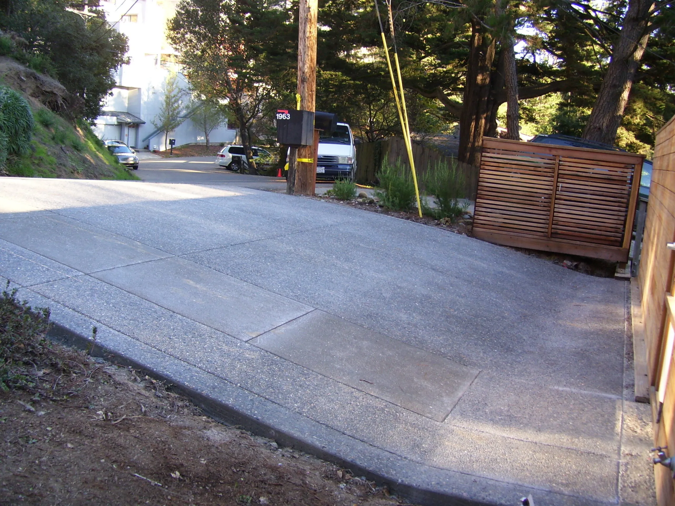 Picture of A smooth, expertly finished driveway slopes gracefully, showcasing the precision and quality craftsmanship of Paradigm Concrete & Construction, Inc. Recognized for expertise and quality, the company ensures every detail meets the highest standards. Copyright ©2025 Diamond Certified Resource. - Paradigm Concrete & Construction, Inc.