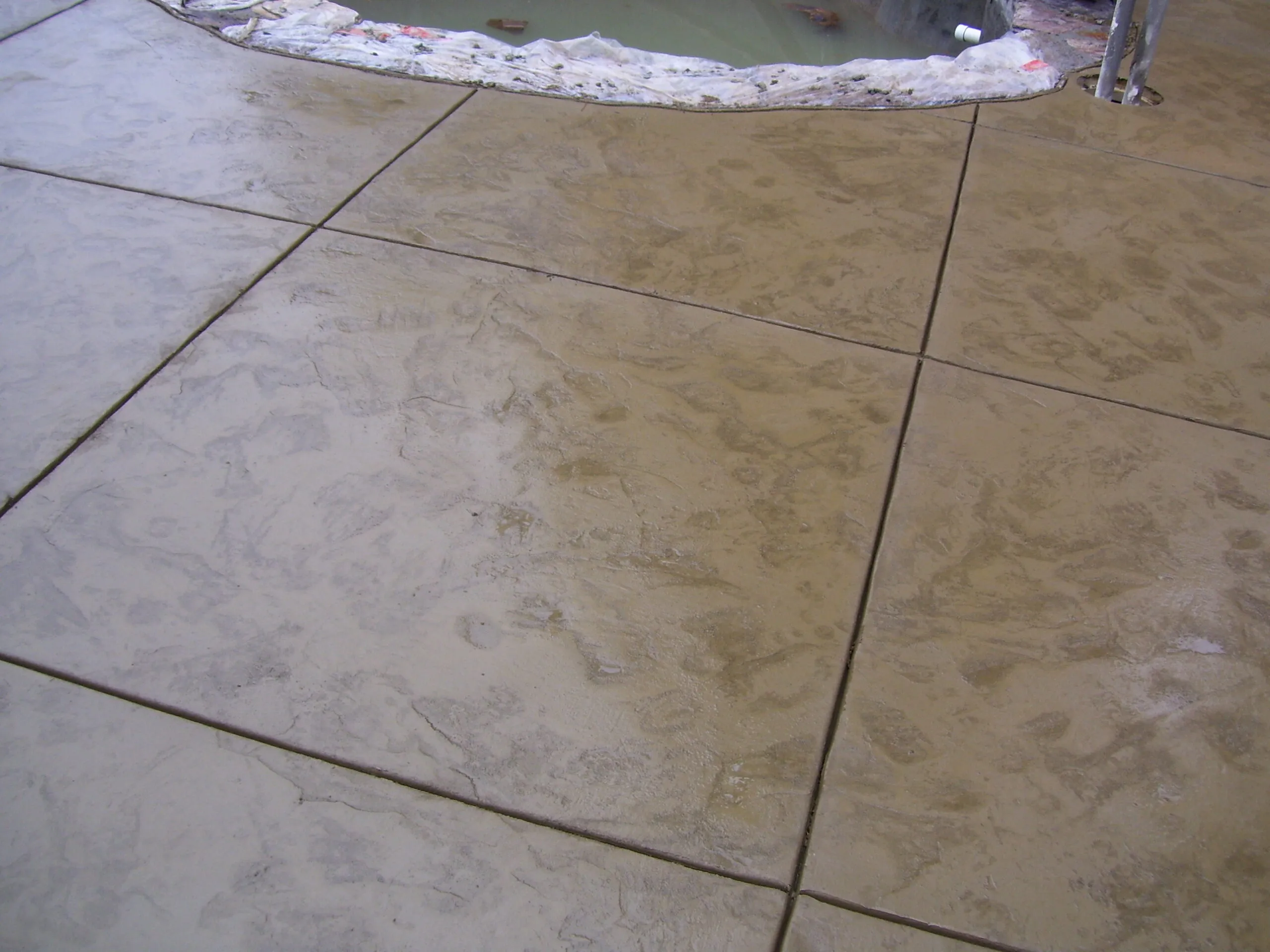 Picture of  Freshly laid concrete creates a seamless surface, embodying Paradigm Concrete & Construction, Inc.'s dedication to quality outcomes. This precision reflects their high customer satisfaction ratings. Copyright ©2025 Diamond Certified Resource.

 - Paradigm Concrete & Construction, Inc.