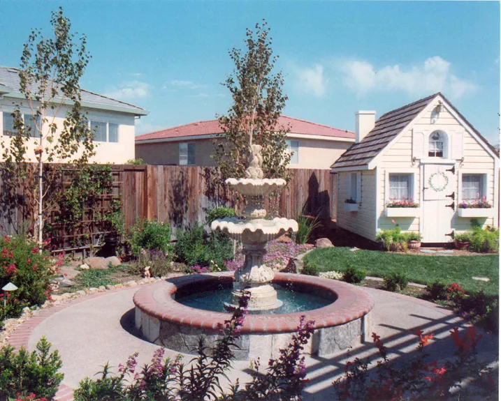 Picture of  A serene garden encloses a tiered stone fountain, reflecting Paradigm Concrete & Construction, Inc.'s commitment to quality outcomes. This tranquil setting embodies their high customer satisfaction ratings. Copyright ©2025 Diamond Certified Resource.

 - Paradigm Concrete & Construction, Inc.