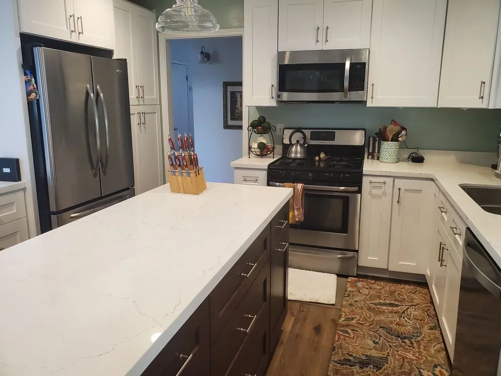 Picture of  A Ramos Construction, Inc. showcases a modern kitchen with sleek white cabinetry and stainless steel appliances, reflecting their focus on quality outcomes. Their expertise in crafting functional spaces shines through in every detail. Copyright ©2025 Diamond Certified Resource.

 - A Ramos Construction, Inc.