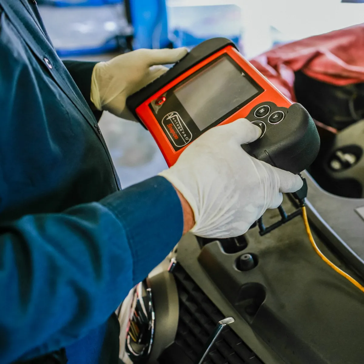 Picture of At Dana Meyer Auto Care, a technician expertly uses diagnostic equipment to ensure vehicles receive precise care. The commitment to quality outcomes is always evident. Copyright ©2025 Diamond Certified Resource - Dana Meyer Auto Care
