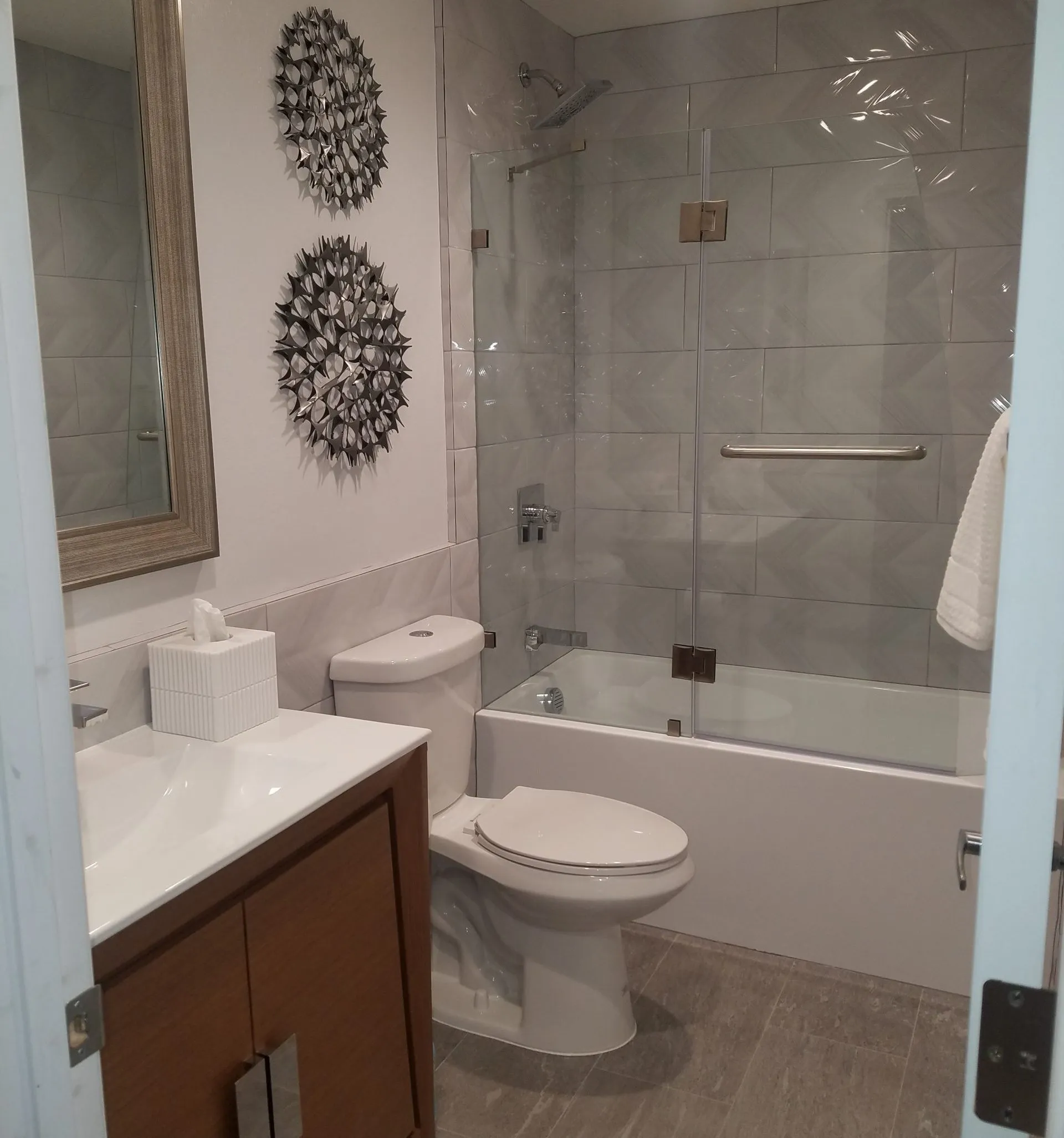 Picture of  In a tranquil bathroom transformation by A Ramos Construction, Inc., refined tile work and elegant fixtures convey a dedication to quality outcomes. Recognized for expertise and quality, the company ensures customer satisfaction through meticulous attention to detail. Copyright ©2025 Diamond Certified Resource.

 - A Ramos Construction, Inc.