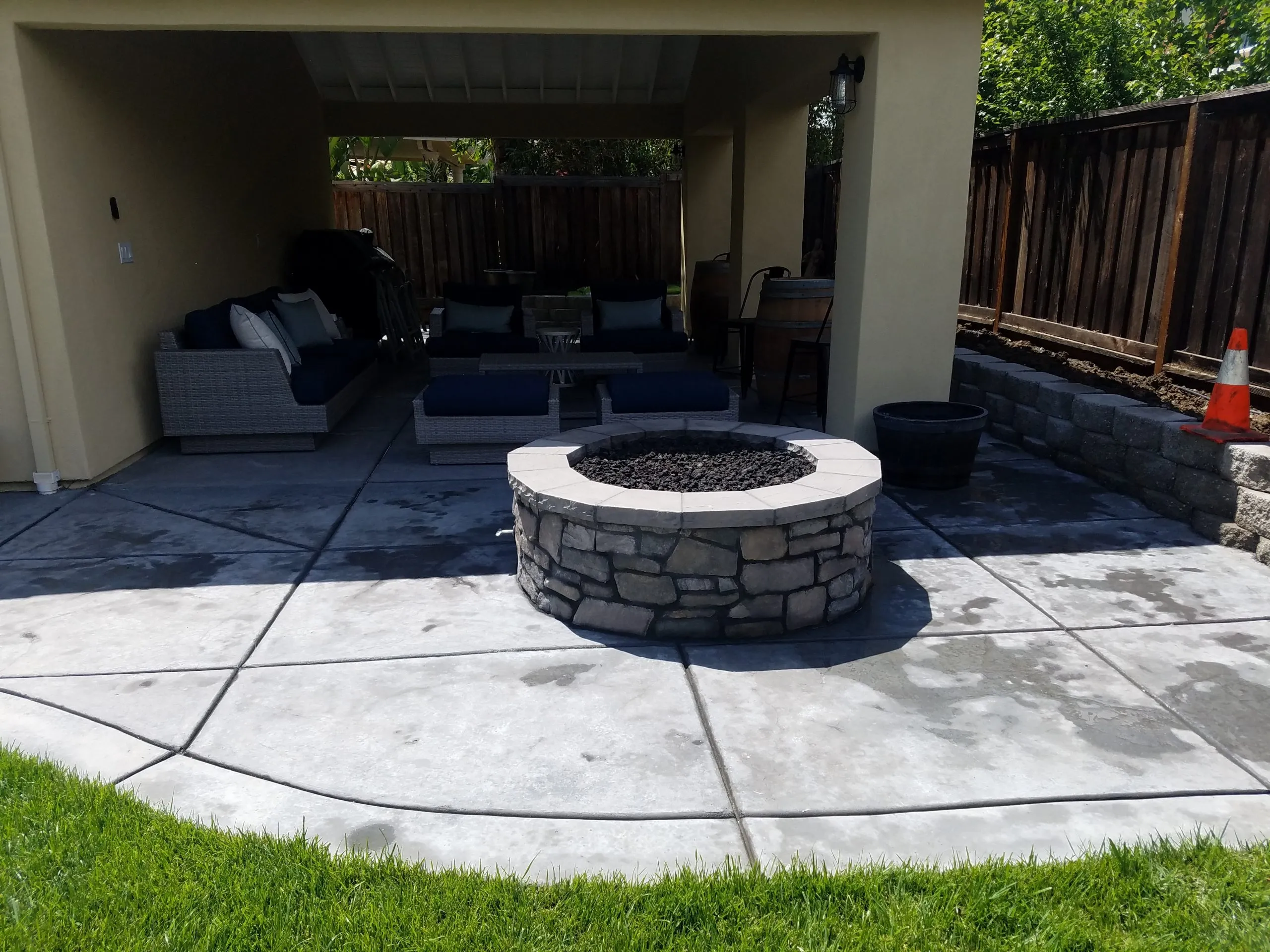 Picture of  A Ramos Construction, Inc. showcases their expertise in crafting inviting outdoor spaces with this elegant stone fire pit surrounded by cozy seating, illustrating their focus on quality outcomes. Copyright ©2025 Diamond Certified Resource.

 - A Ramos Construction, Inc.