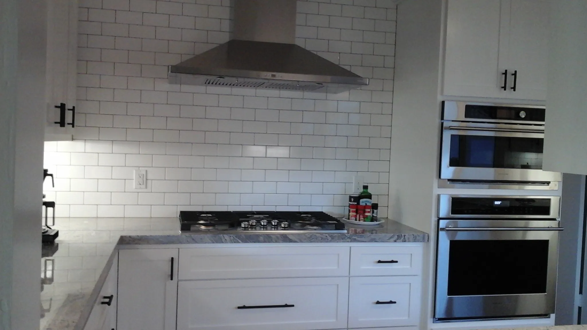 Picture of In this sleek kitchen, A Ramos Construction, Inc. showcases its commitment to quality with a modern setup featuring stainless steel appliances and a charming subway tile backsplash. The company is recognized for expertise and quality. Copyright ©2025 Diamond Certified Resource

 - A Ramos Construction, Inc.