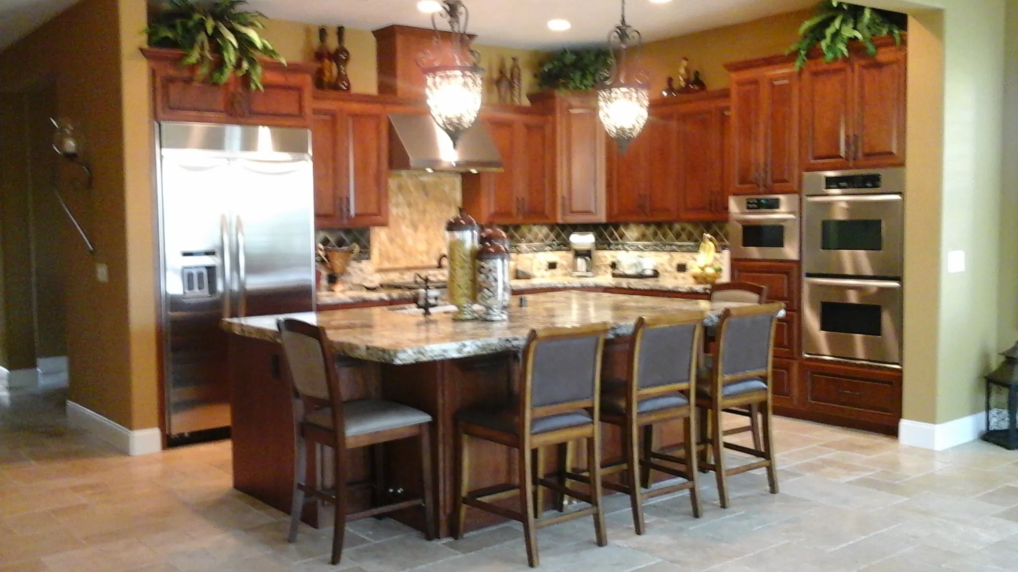 Picture of In this elegantly crafted kitchen, A Ramos Construction, Inc. showcases its commitment to quality outcomes with rich wooden cabinetry and sleek stainless steel appliances, underscoring their top-rated quality. Copyright ©2025 Diamond Certified Resource

 - A Ramos Construction, Inc.