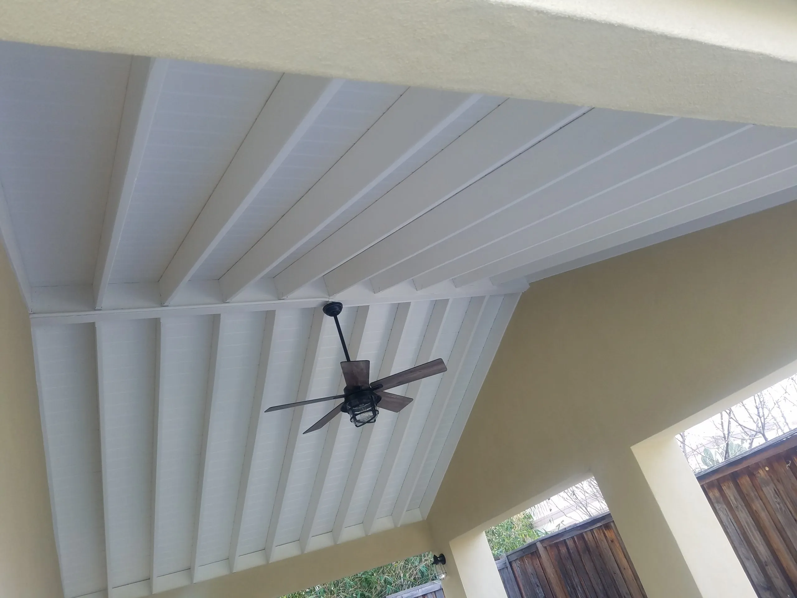 Picture of Beneath a newly constructed patio cover, the precise angles and clean lines of the wooden beams reflect A Ramos Construction, Inc.'s commitment to quality outcomes. Recognized for their expertise, this project showcases their dedication to excellence. Copyright ©2025 Diamond Certified Resource

 - A Ramos Construction, Inc.