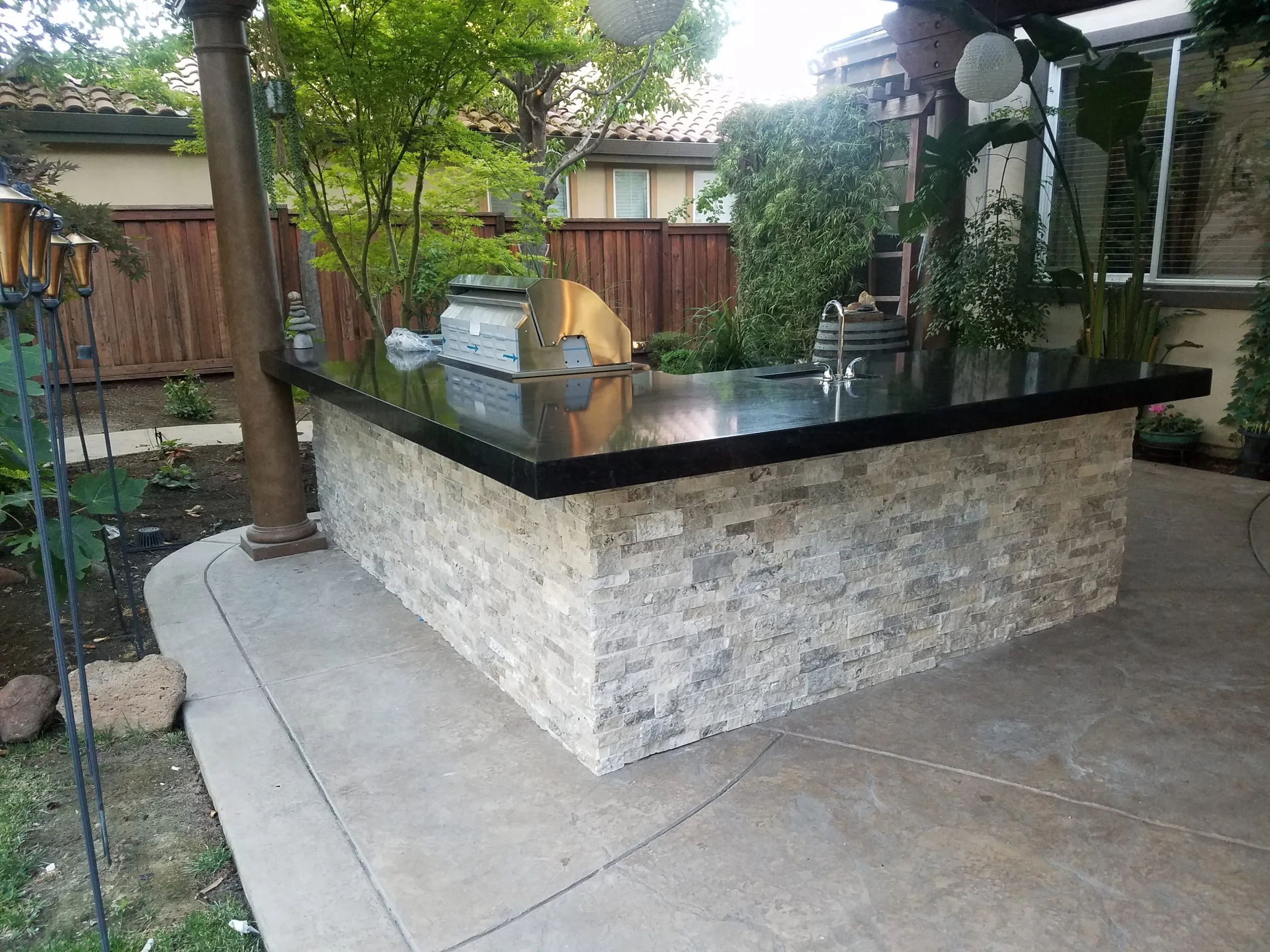 Picture of In a serene backyard setting, a sleek outdoor kitchen crafted by A Ramos Construction, Inc. invites gatherings and culinary adventures. Recognized for expertise and quality, the company transforms spaces into functional elegance. Copyright ©2025 Diamond Certified Resource - A Ramos Construction, Inc.