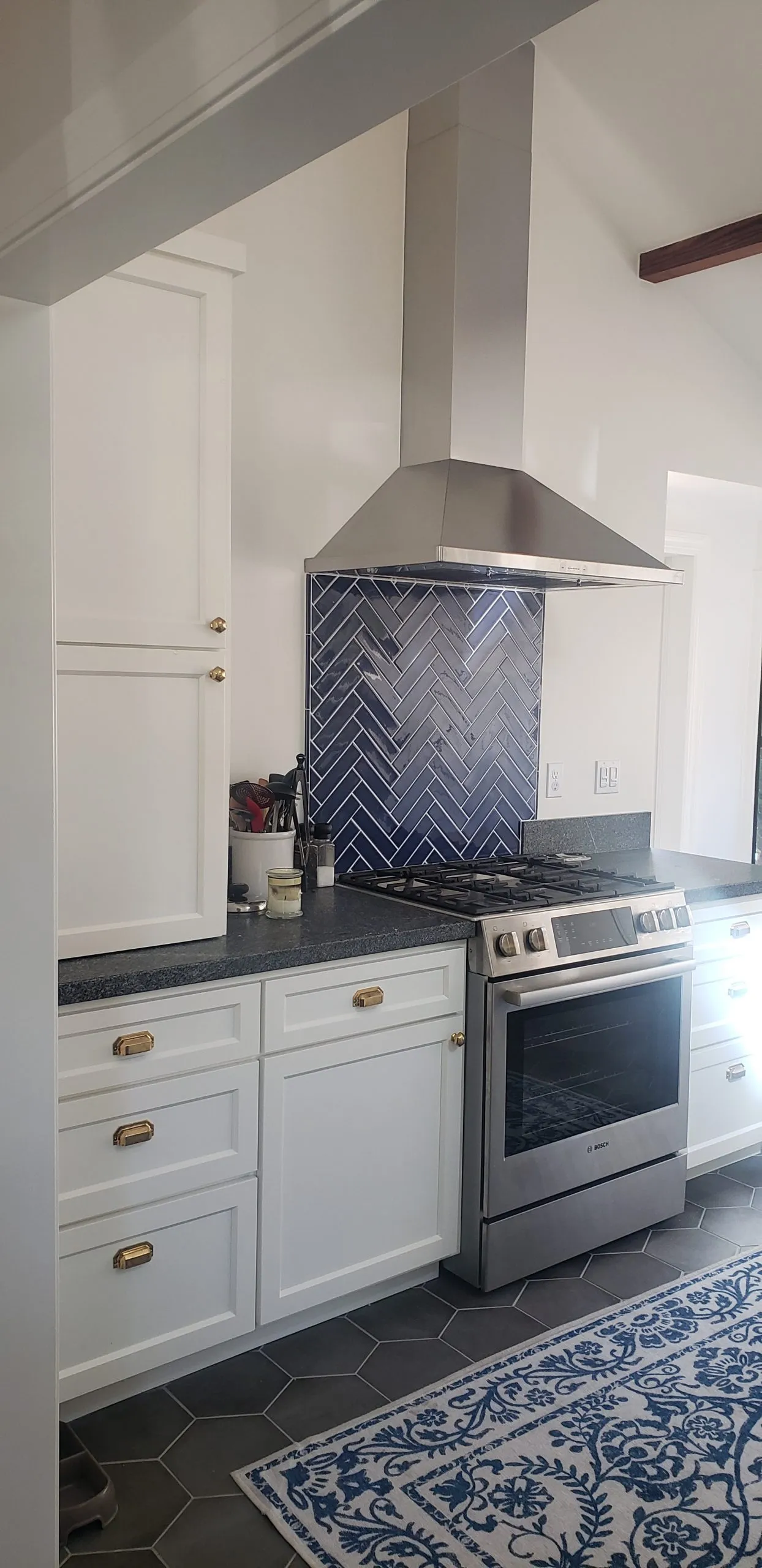 Picture of A Ramos Construction, Inc. showcases its commitment to quality with a sleek kitchen renovation, highlighted by a herringbone tile backsplash and modern stainless steel appliances. The company is recognized for expertise and quality. Copyright ©2025 Diamond Certified Resource

 - A Ramos Construction, Inc.