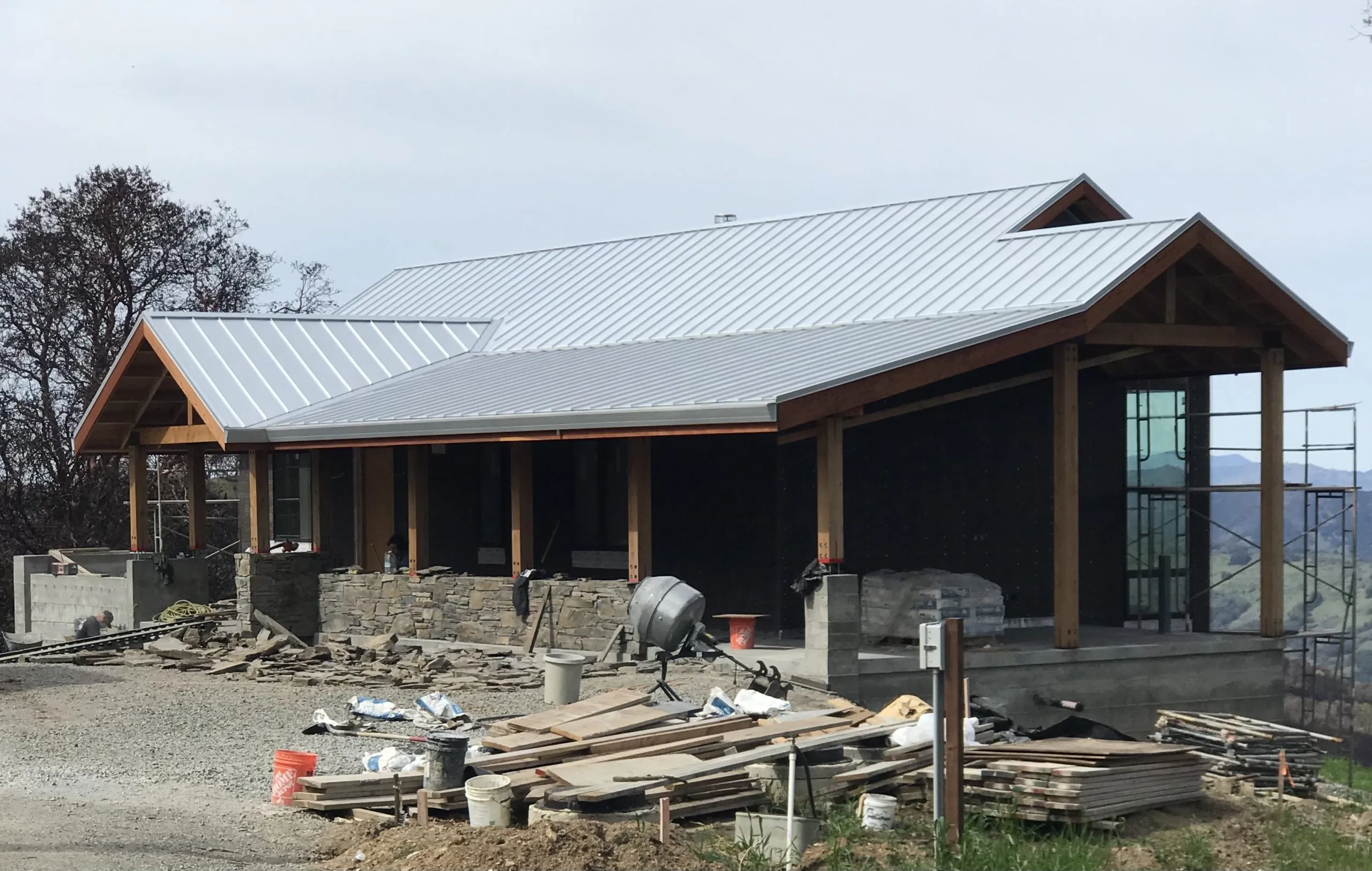 Picture of A new metal roof caps the construction of a modern home, showcasing Crandall Roofing Inc.'s dedication to quality outcomes. The expertly crafted roof reflects the company's recognition for expertise and quality. Copyright ©2025 Diamond Certified Resource - Crandall Roofing Inc.