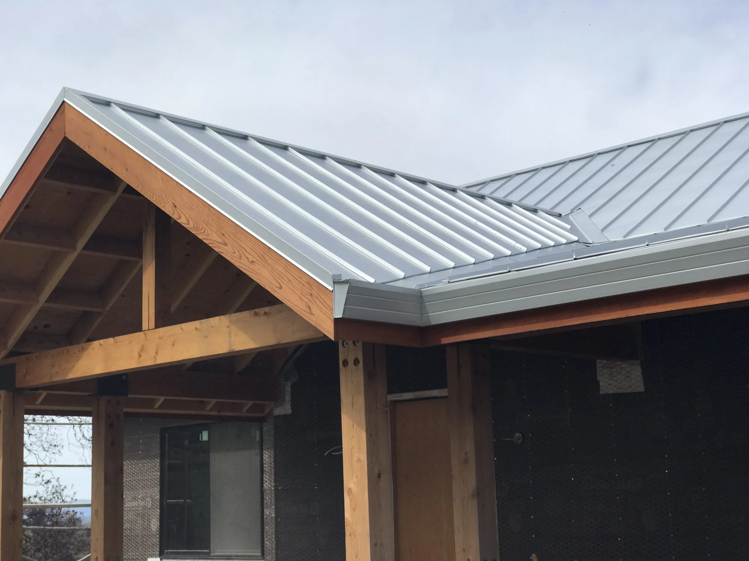 Picture of The sleek lines of a new metal roof reflect Crandall Roofing Inc.'s commitment to quality outcomes, creating durable and visually appealing structures. The company focuses on quality outcomes, ensuring customer satisfaction. Copyright ©2025 Diamond Certified Resource - Crandall Roofing Inc.