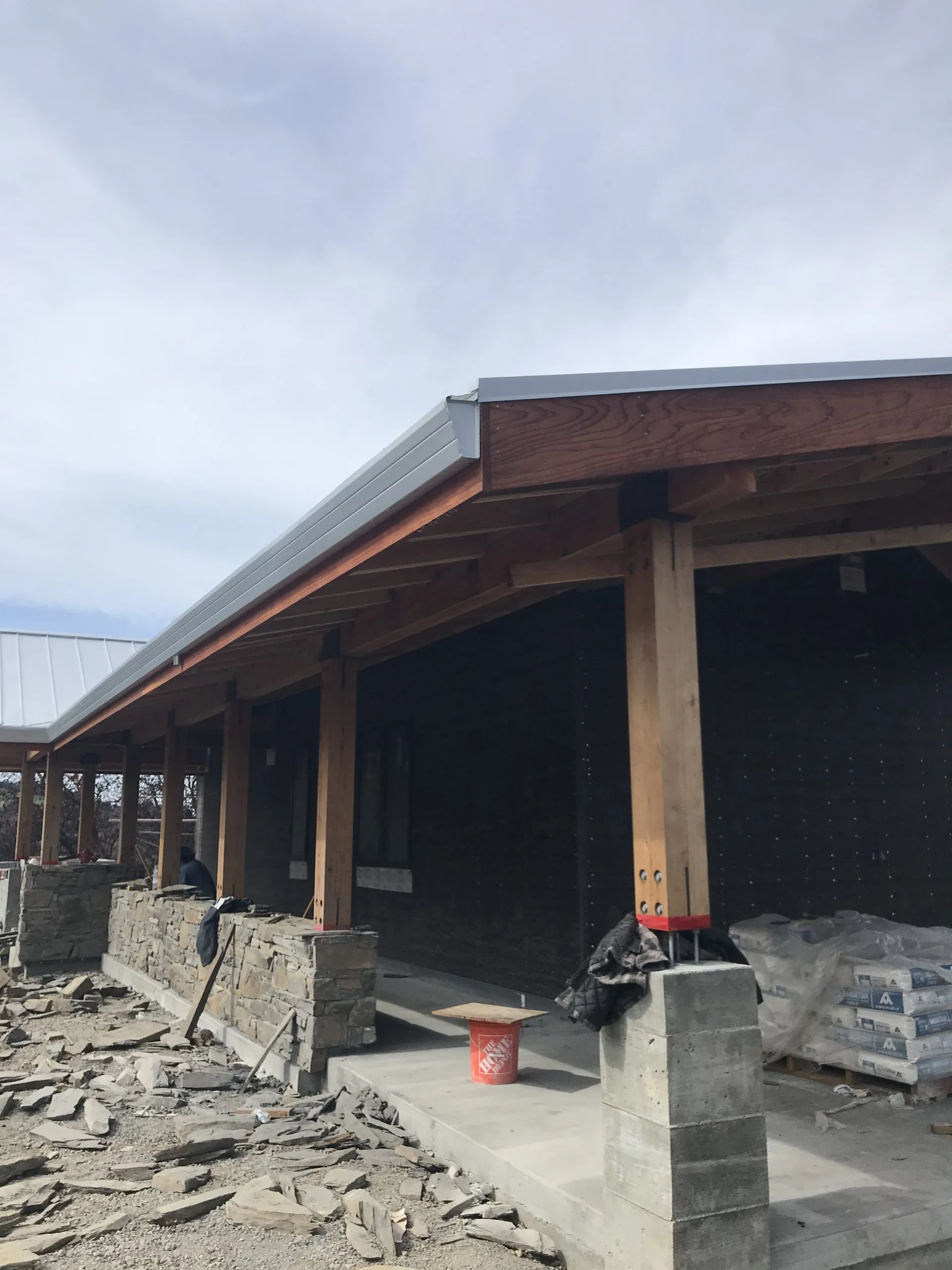 Picture of A nearly completed porch roof showcases Crandall Roofing Inc.â€™s dedication to quality outcomes. With expert craftsmanship and attention to detail, the project nears completion, reflecting their high customer satisfaction ratings. Copyright ©2025 Diamond Certified Resource

 - Crandall Roofing Inc.