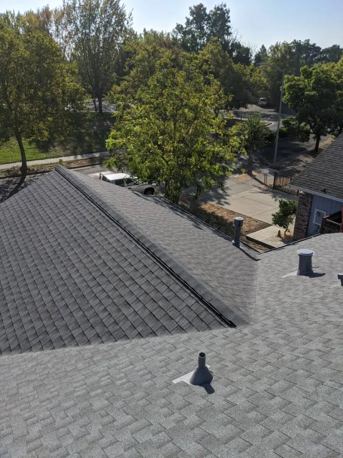 Picture of The meticulously installed shingles on this residential roof exemplify Crandall Roofing Inc.'s commitment to quality outcomes. The company focuses on each detail to ensure customer satisfaction. Copyright ©2025 Diamond Certified Resource

 - Crandall Roofing Inc.