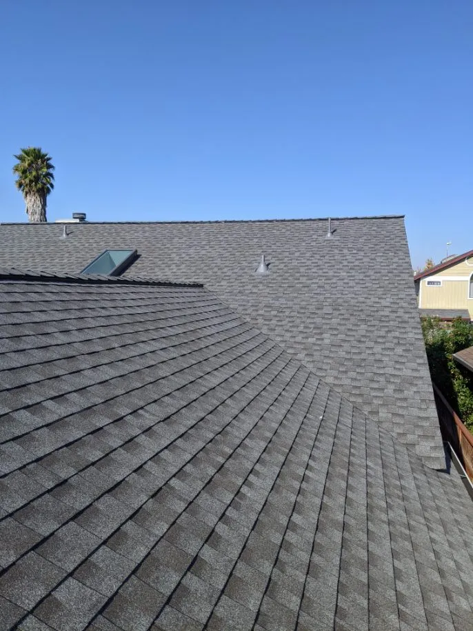 Picture of The freshly installed shingles glisten under the clear sky, a testament to Crandall Roofing Inc.â€™s dedication to quality outcomes. Recognized for their expertise and quality, every detail speaks volumes. Copyright ©2025 Diamond Certified Resource

 - Crandall Roofing Inc.