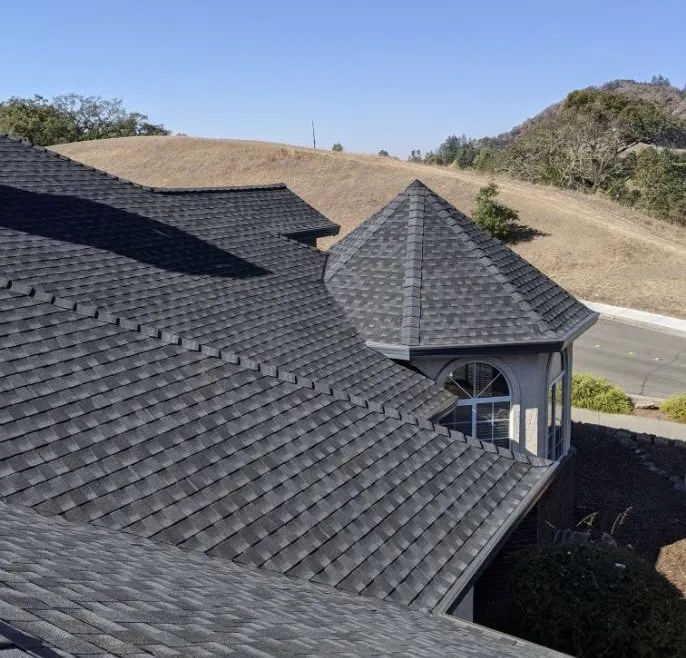 Picture of The pristine geometric pattern of newly installed shingles demonstrates Crandall Roofing Inc.'s commitment to quality outcomes. Their expertise ensures every project is crafted with precision. Copyright ©2025 Diamond Certified Resource

 - Crandall Roofing Inc.