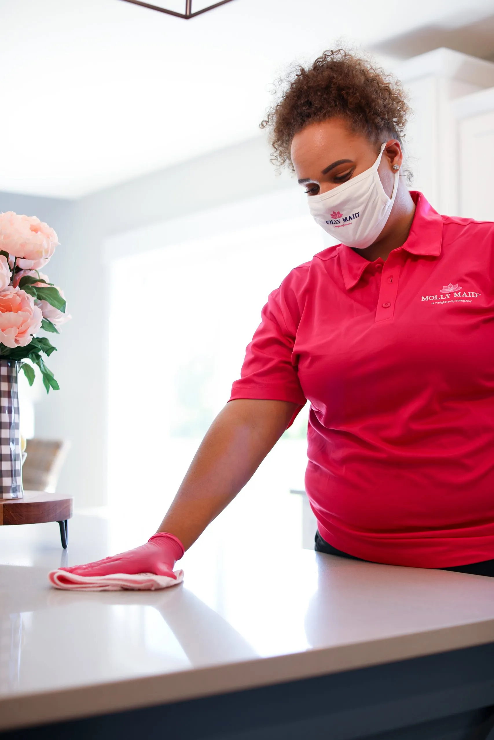 Picture of A Molly Maid of S. Silicon Valley team member meticulously cleans a kitchen surface, embodying the company's focus on quality outcomes. This attention to detail is why the company consistently achieves a Highest in Quality rating. Copyright ©2025 Diamond Certified Resource

 - Molly Maid of S. Silicon Valley