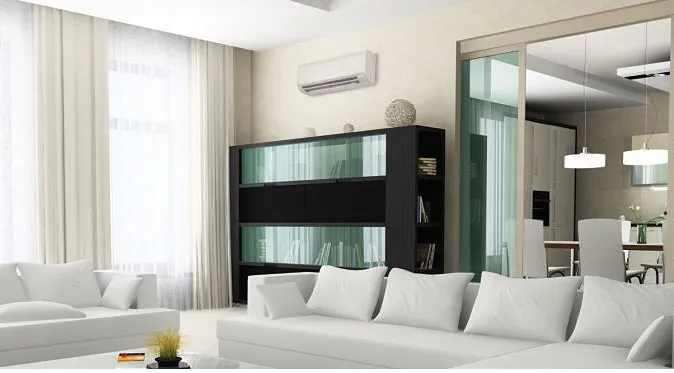 Modern living room with white sofas, a black bookshelf, and an air conditioning unit mounted on the wall. Modern living room with white sofas, a black bookshelf, and an air conditioning unit mounted on the wall.