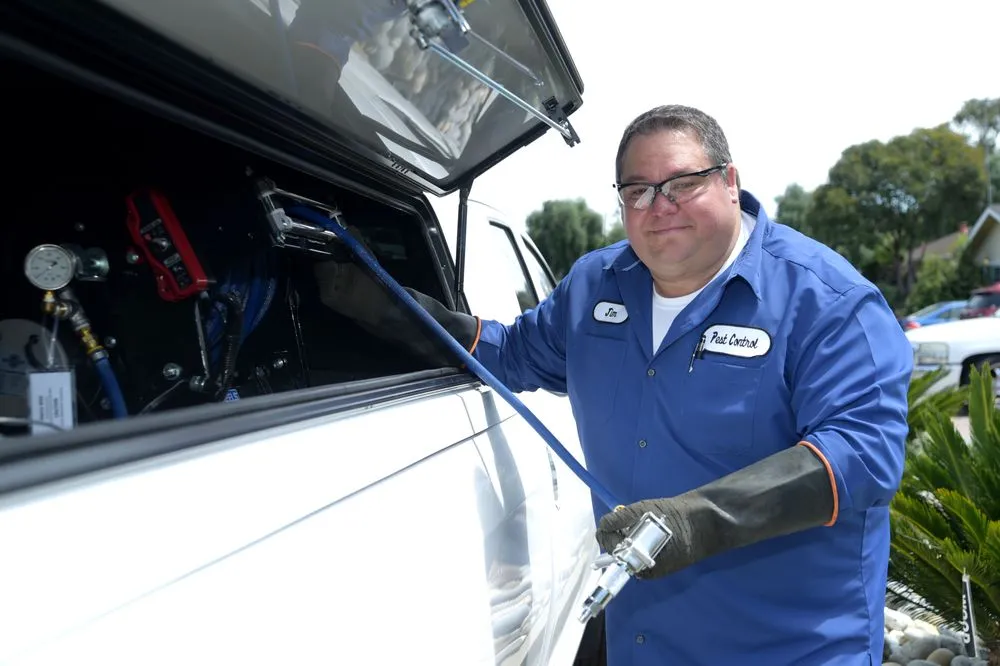 Picture of A technician from Presto Pest Control, Inc. prepares his equipment, exemplifying the company’s dedication to high quality outcomes. Recognized for expertise and quality, the team ensures comprehensive service. Copyright ©2025 Diamond Certified Resource. - Presto Pest Control, Inc.