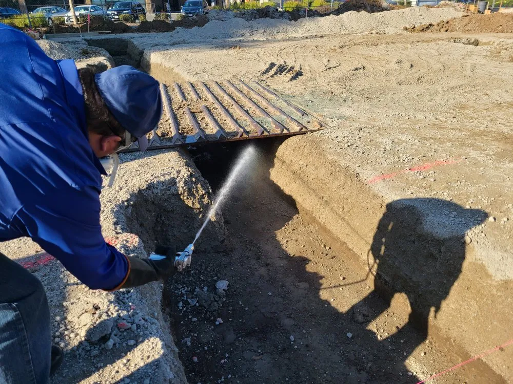 Picture of  A technician from Presto Pest Control, Inc. diligently sprays a trench at a construction site, underscoring the company's commitment to quality outcomes in pest management. Presto Pest Control is recognized for expertise and quality. Copyright ©2025 Diamond Certified Resource.

 - Presto Pest Control, Inc.