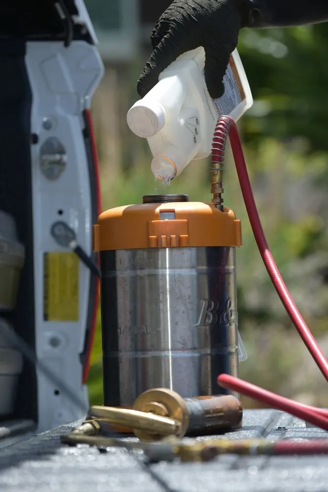 Picture of  A gloved hand meticulously pours a liquid into a pest control sprayer, signifying Presto Pest Control, Inc.'s commitment to precision and quality outcomes. Consistently achieving a Highest in Quality rating, the company exemplifies top-tier expertise in every detail. Copyright ©2025 Diamond Certified Resource.

 - Presto Pest Control, Inc.
