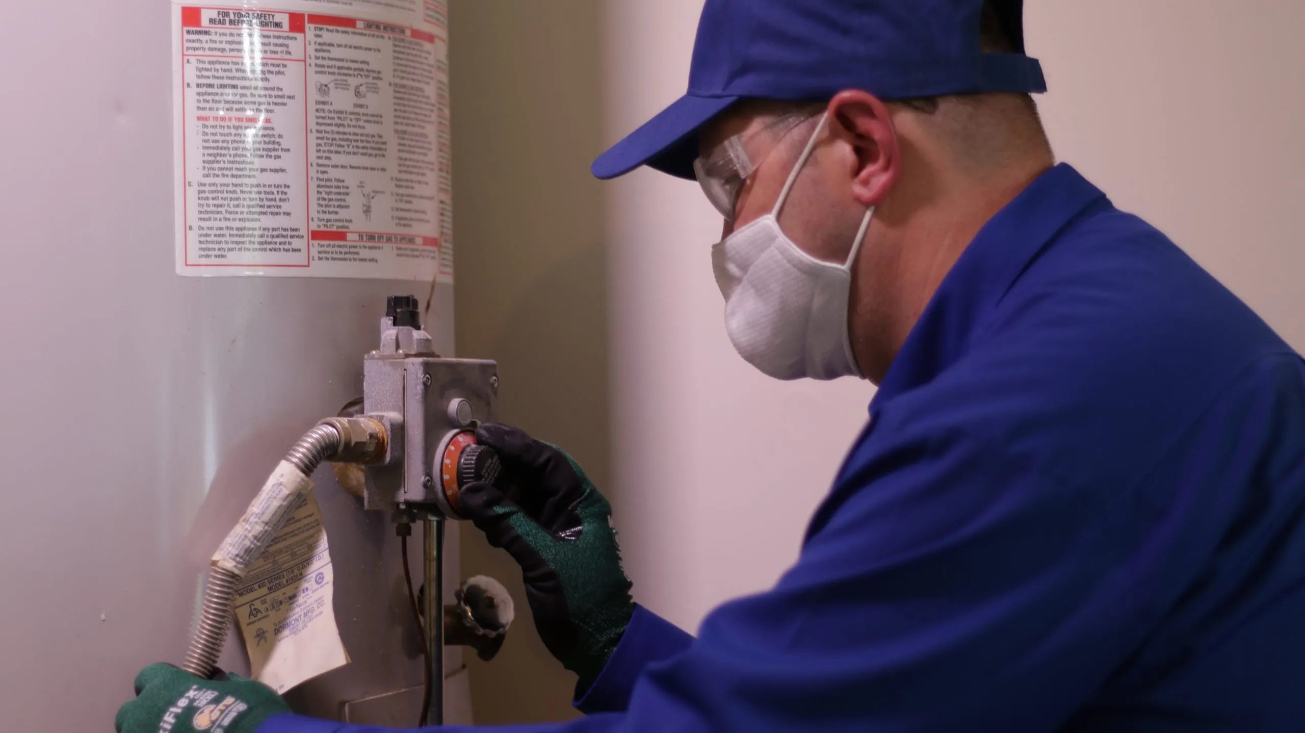 Picture of A skilled technician from ARS® / Rescue Rooter® carefully adjusts a water heater, showcasing the company's focus on quality outcomes. Recognized for expertise and quality, every detail matters. Copyright ©2025 Diamond Certified Resource. - ARS® / Rescue Rooter®