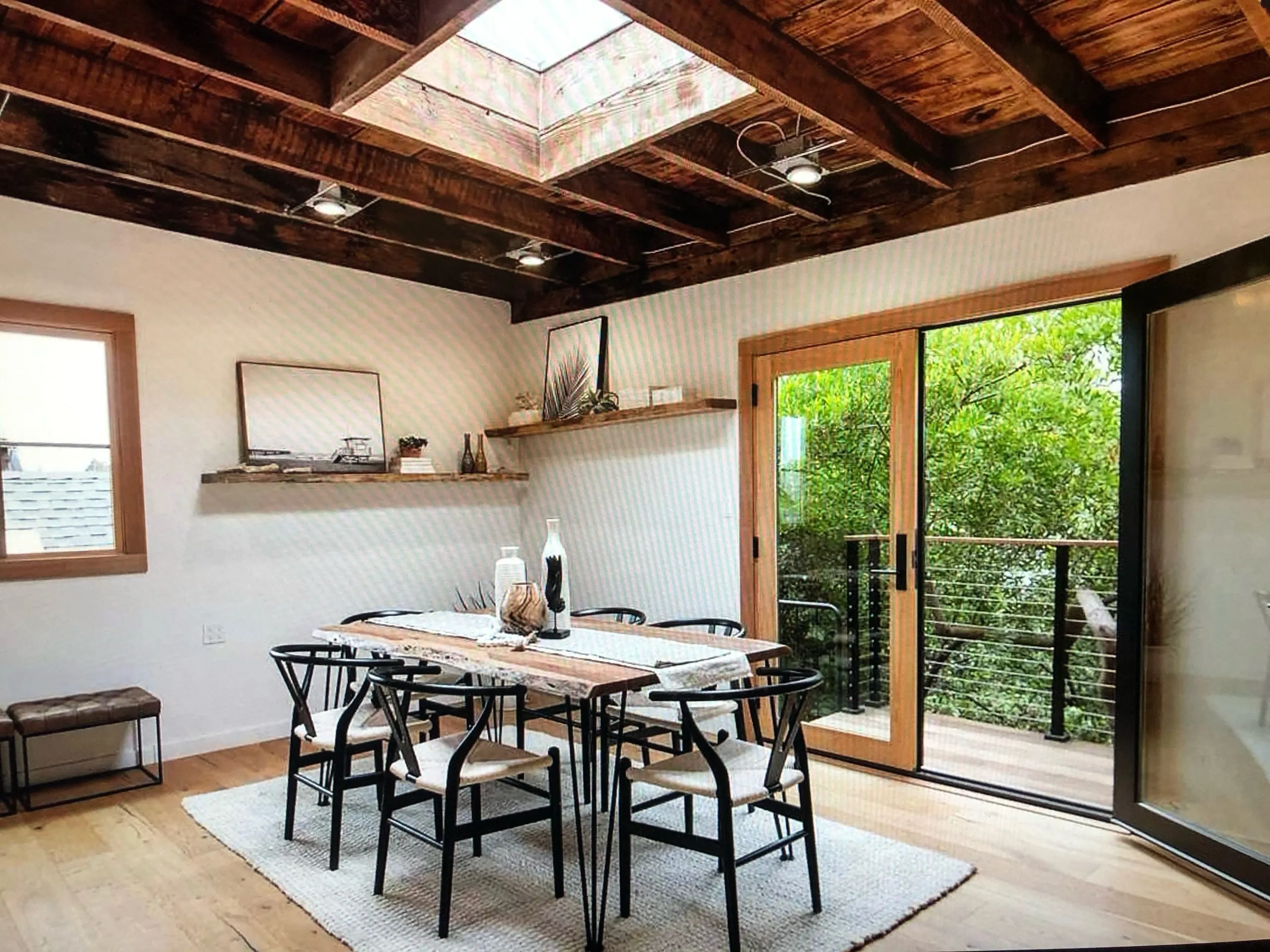 Picture of Sunlight streams through a skylight, illuminating this thoughtfully designed dining space by Green Living Builders LLC. Their commitment to quality outcomes is evident in every detail. Copyright ©2025 Diamond Certified Resource

 - Green Living Builders LLC