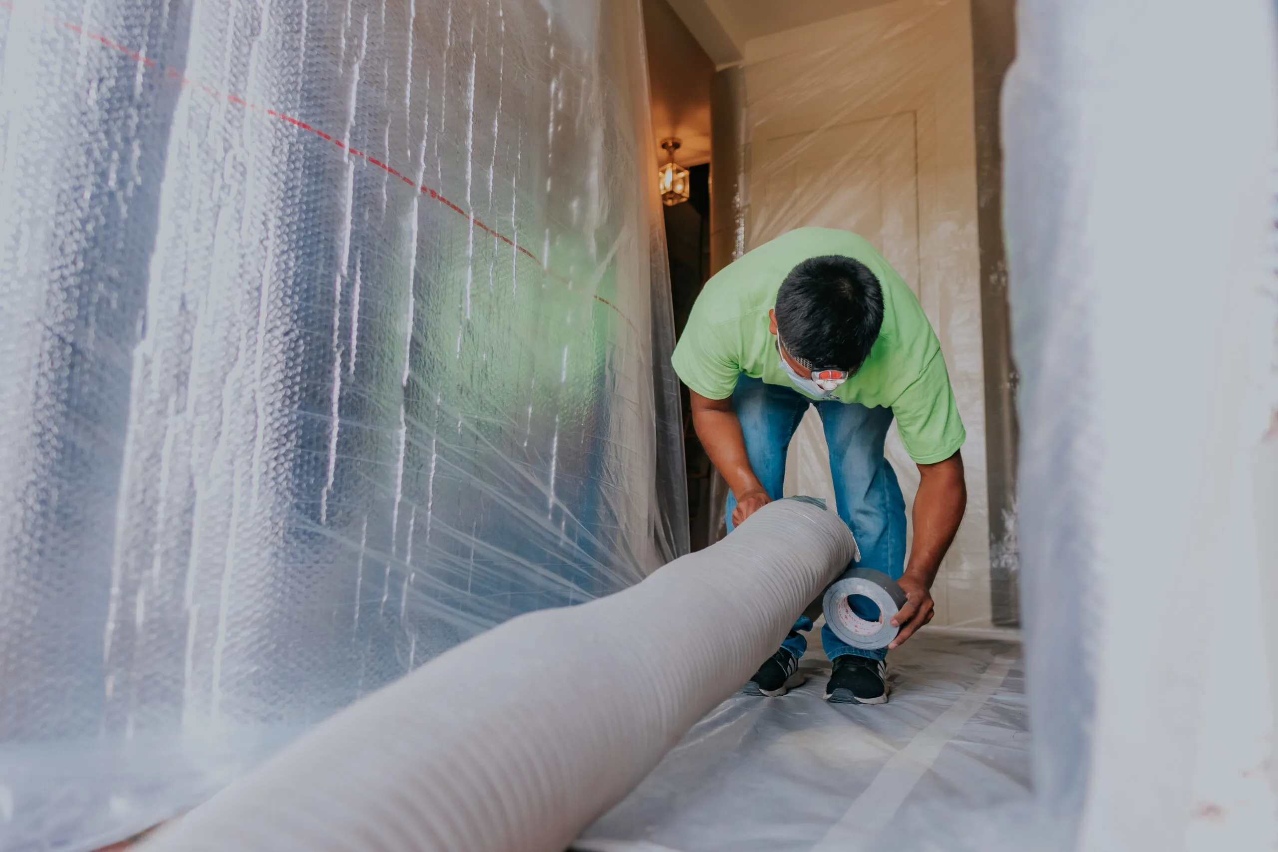 Picture of A meticulous worker prepares ducting for a project, showcasing Attic Pros' commitment to quality outcomes. The attention to detail reflects why they are recognized for expertise and quality. Copyright ©2025 Diamond Certified Resource

 - Attic Pros