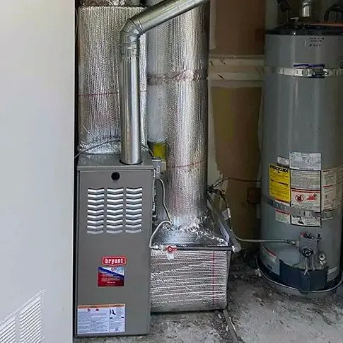 Picture of In a well-organized utility space, Air Care Heating & Cooling, Inc. showcases its commitment to quality with a neatly installed heating system, embodying its focus on quality outcomes. Copyright ©2025 Diamond Certified Resource

 - Air Care Heating & Cooling, Inc.