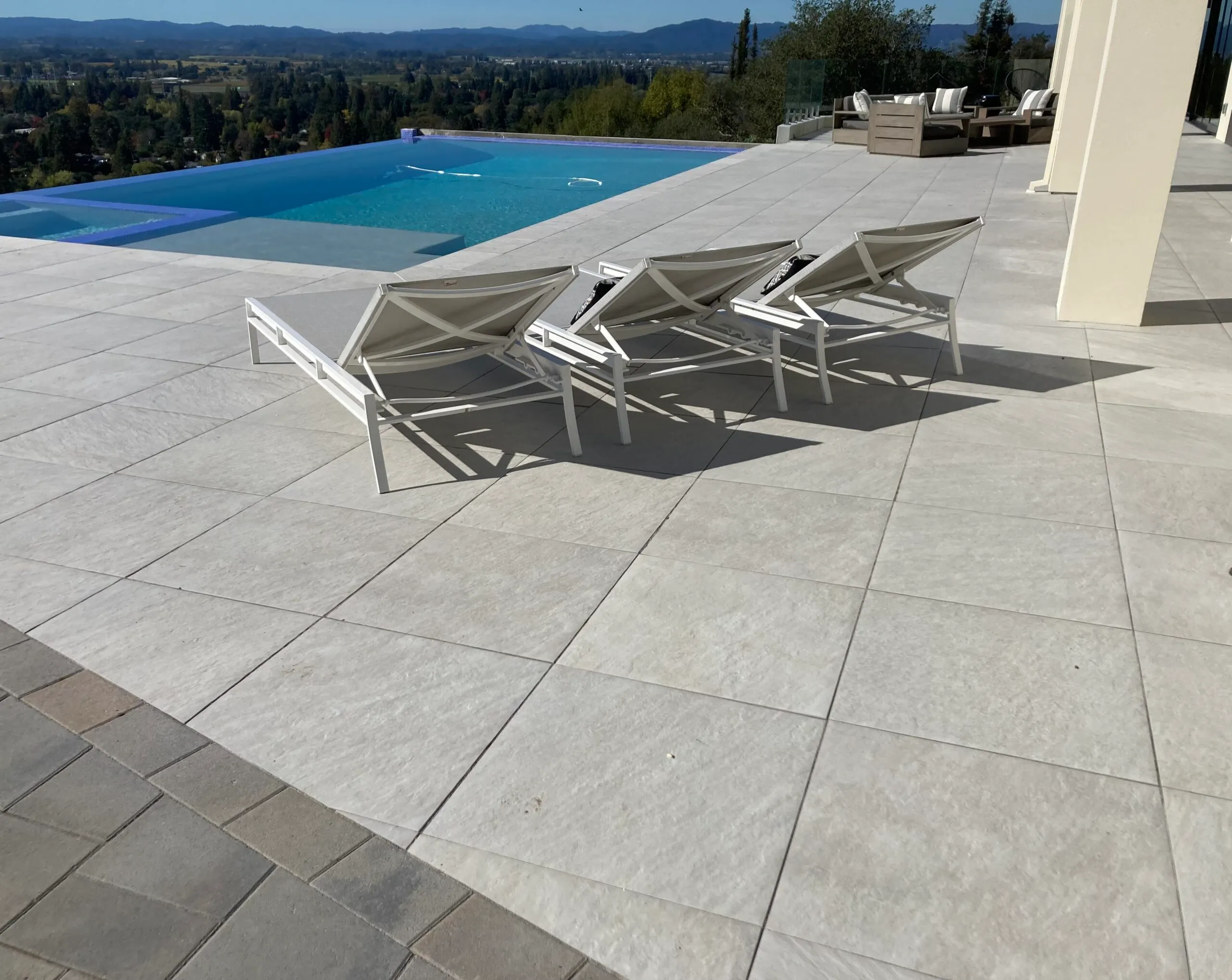 Picture of Sunlit serenity by the pool showcases The Legacy Paver Group's precise craftsmanship in an expansive, elegant patio design. The company focuses on quality outcomes, creating perfect spaces for relaxation. Copyright ©2025 Diamond Certified Resource

 - The Legacy Paver Group